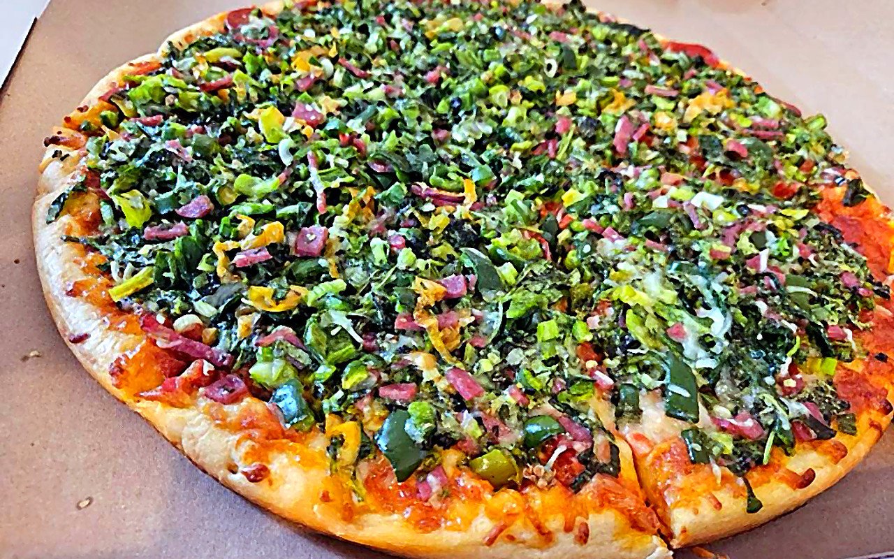 Loaded vegetable pizza fresh from the oven